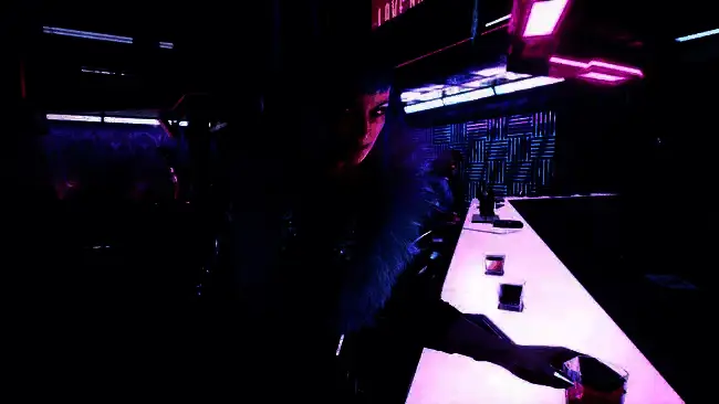 Josh Sawyer接受采访现场照片，背景为游戏开发相关设备与资料