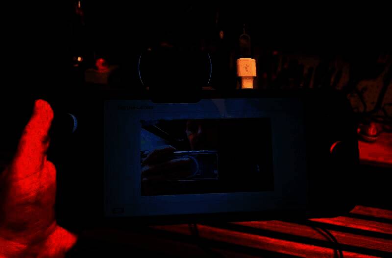 电脑屏幕显示摄像头设备信息，重点标注帧率与传输模式