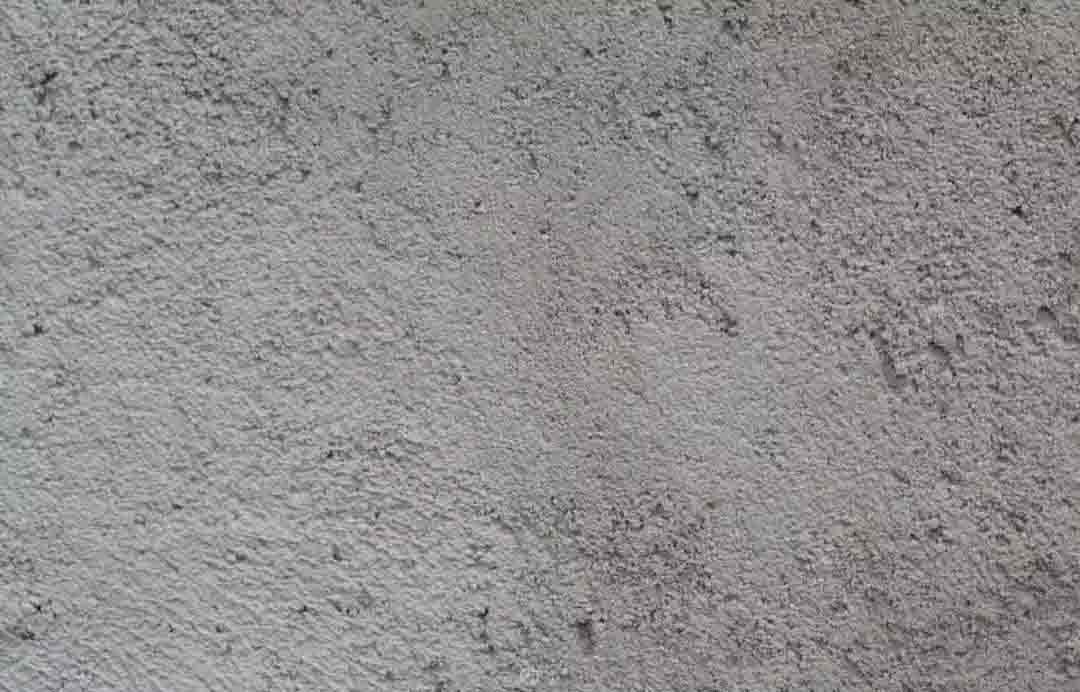 水泥墙面的高清图片，表面布满细微纹理