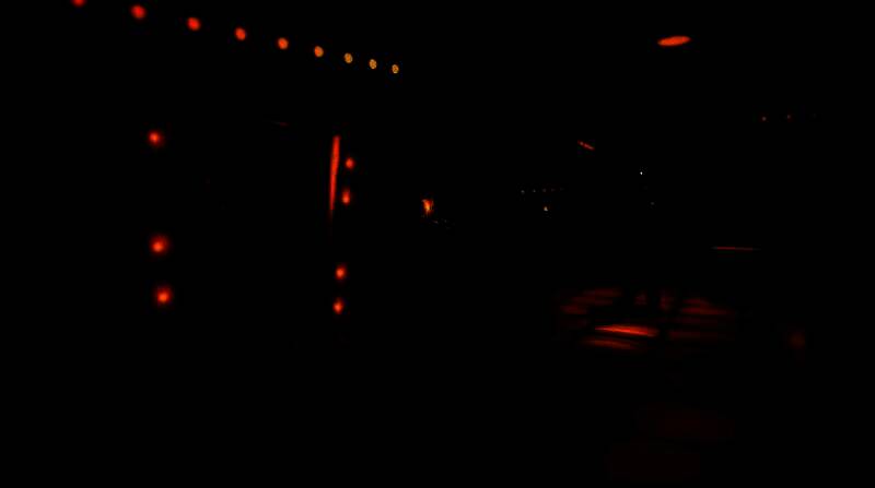 游戏角色鲍里斯手持扳手，在昏暗走廊中警惕前行，背景弥漫着诡异墨水