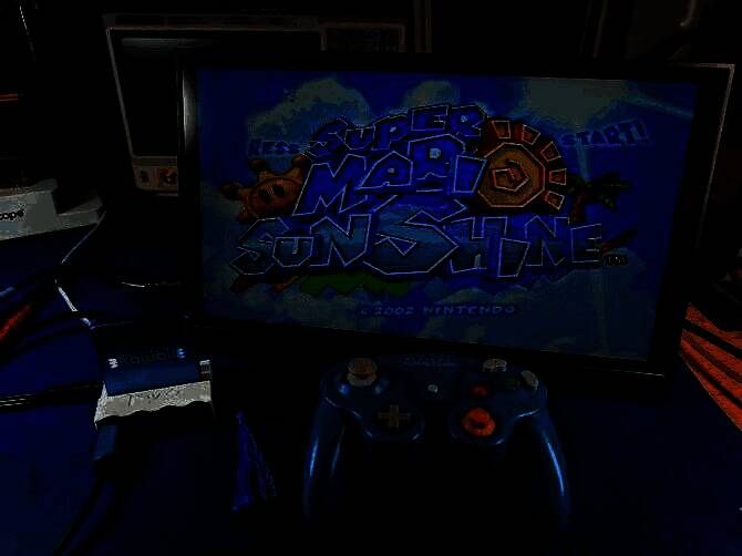 迷你主机底部特写，可见多个扩展接口及散热孔设计