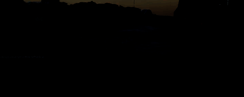 玩家角色手持步枪站在发光的开罗尔生物旁，地面散落着蓝色能量晶体