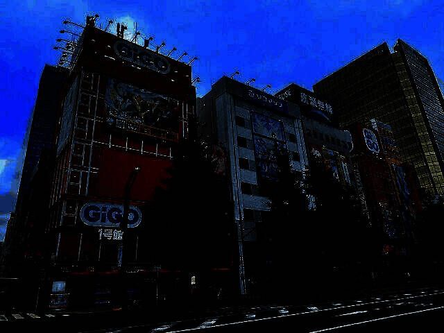 秋叶原GiGO 1号馆街机厅外观，霓虹灯招牌醒目，门口人来人往，充满怀旧氛围