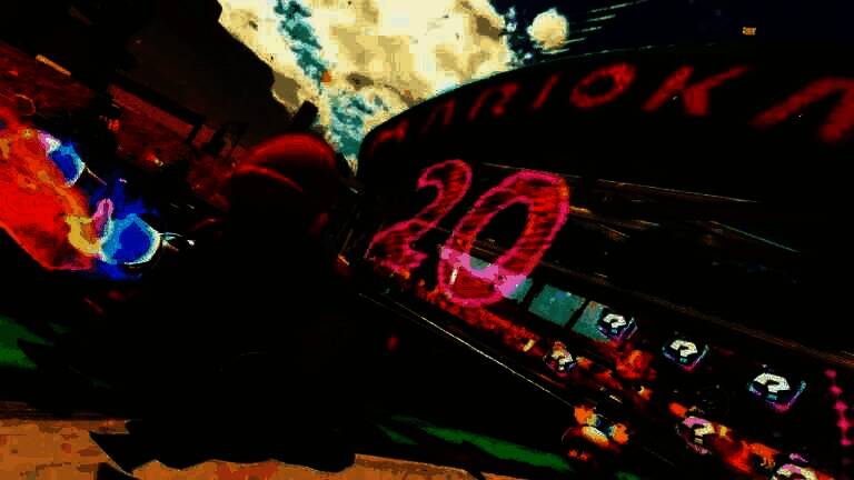 《马里奥赛车：世界》游戏画面，角色驾驶卡丁车在垂直墙面上高速行驶，背景为充满未来感的城市赛道