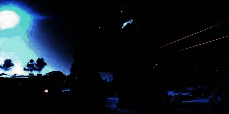 《绝地潜兵2》中玩家小队在爆炸火光中与成群外星敌人激烈交火的战场场景