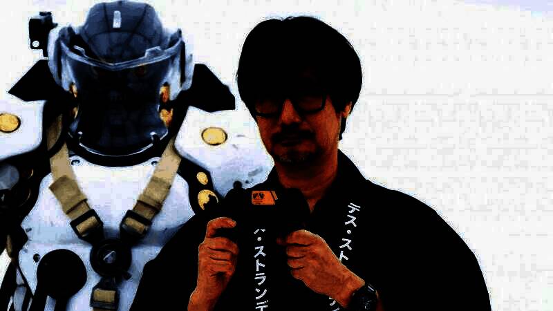 小岛秀夫在工作室中与团队讨论游戏设计，背景屏幕显示神秘新作画面