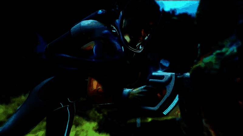 Unknown Worlds工作室团队工作场景，背景为《深海迷航2》概念艺术图与开发界面