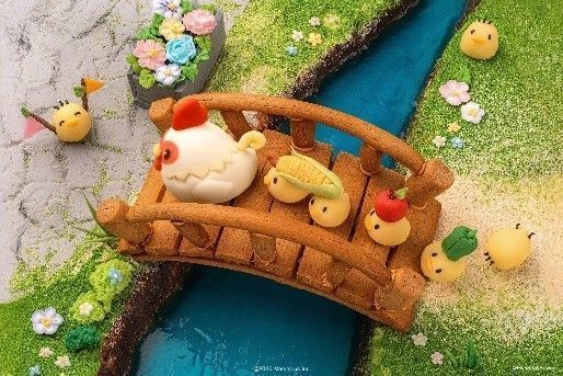 一组动物主题马卡龙，分别做成小鸡、小牛和狗狗造型，色彩柔和，极具童趣