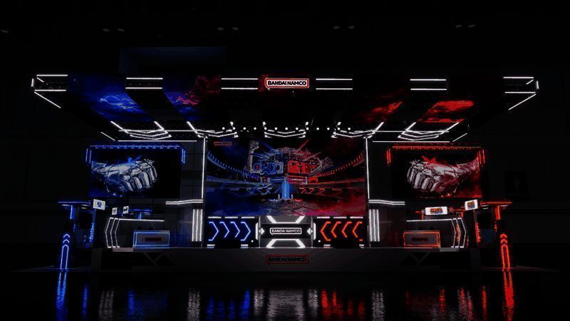 万代南梦宫展台概念图，充满科技感的灯光与标志性角色形象交相辉映，现场氛围热烈