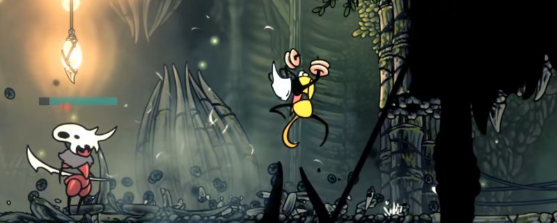 《空洞骑士：丝之歌》游戏中沙克拉战斗场景，背景为幽暗洞穴，沙克拉释放技能攻击敌人