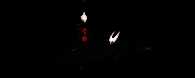 沙克尔所在位置示意图，NPC位于洞窟深处，周围环绕着发光植物和古老石碑