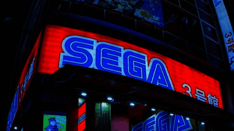 一台任天堂3DS开发机静置于桌面上，屏幕显示着《索尼克世代》原型菜单界面，周围散落着数据线与标签纸