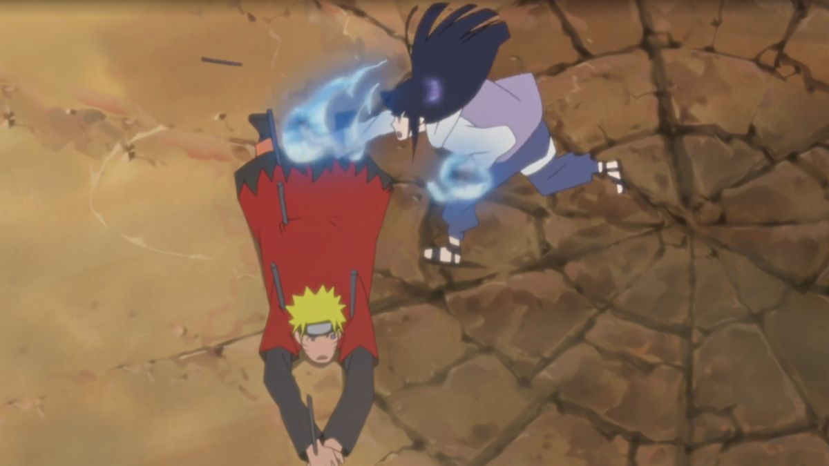 雏田跪地守护鸣人，双手释放强大查克拉冲击佩恩，泪水与决心交织