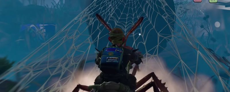 玩家骑乘蚂蚁在蛛网区域缓慢前行的游戏画面，背景可见密集的蜘蛛网结构