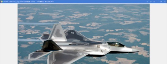 2345看图王主界面截图，当前正显示一张风景照片，顶部菜单栏清晰可见‘文字’功能图标高亮状态